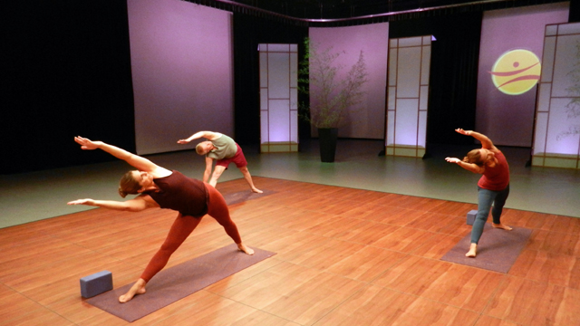 Students putting yoga lessons into practice.